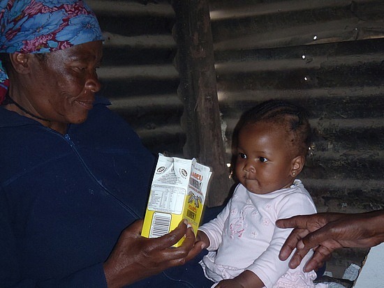 Momma   feeding her baby in the shabeen