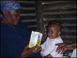 Momma   feeding her baby in the shabeen